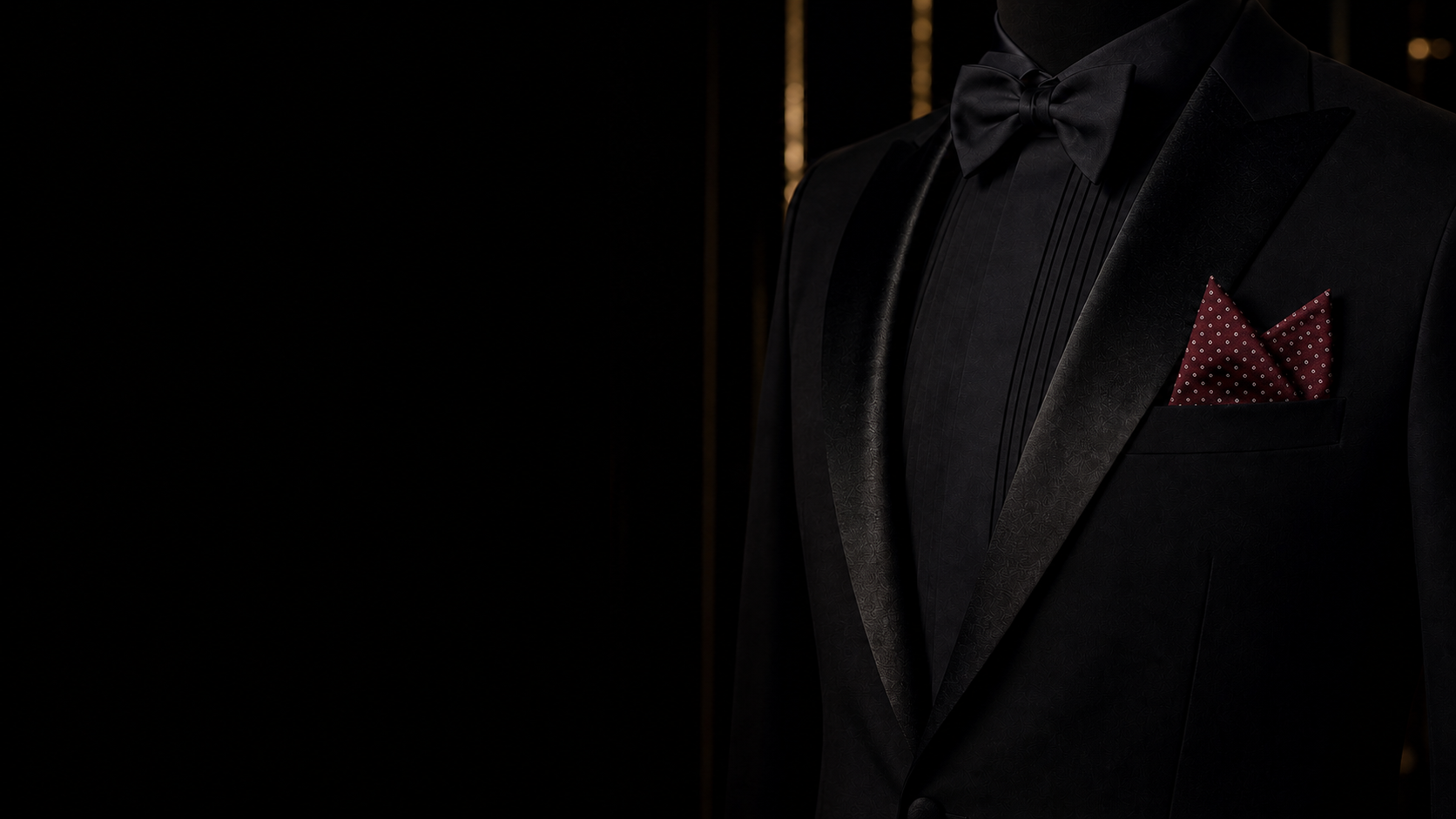 A polished ivory pocket square held perfectly in a black dinner jacket